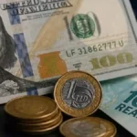 Dólar cai a R$ 5,10 após Copom cortar juros a 14%
